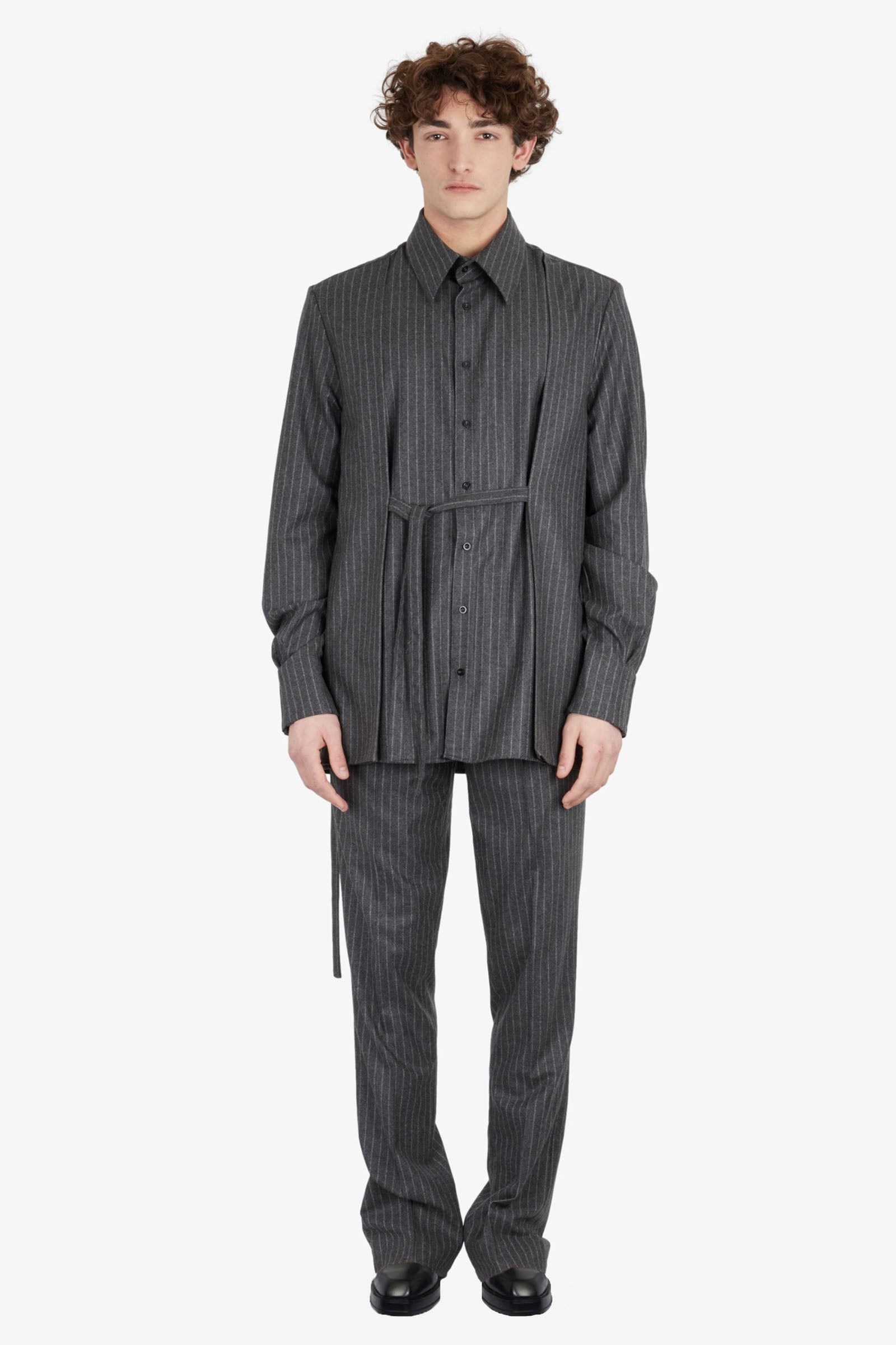 Tailored trousers with strapped falling pocket