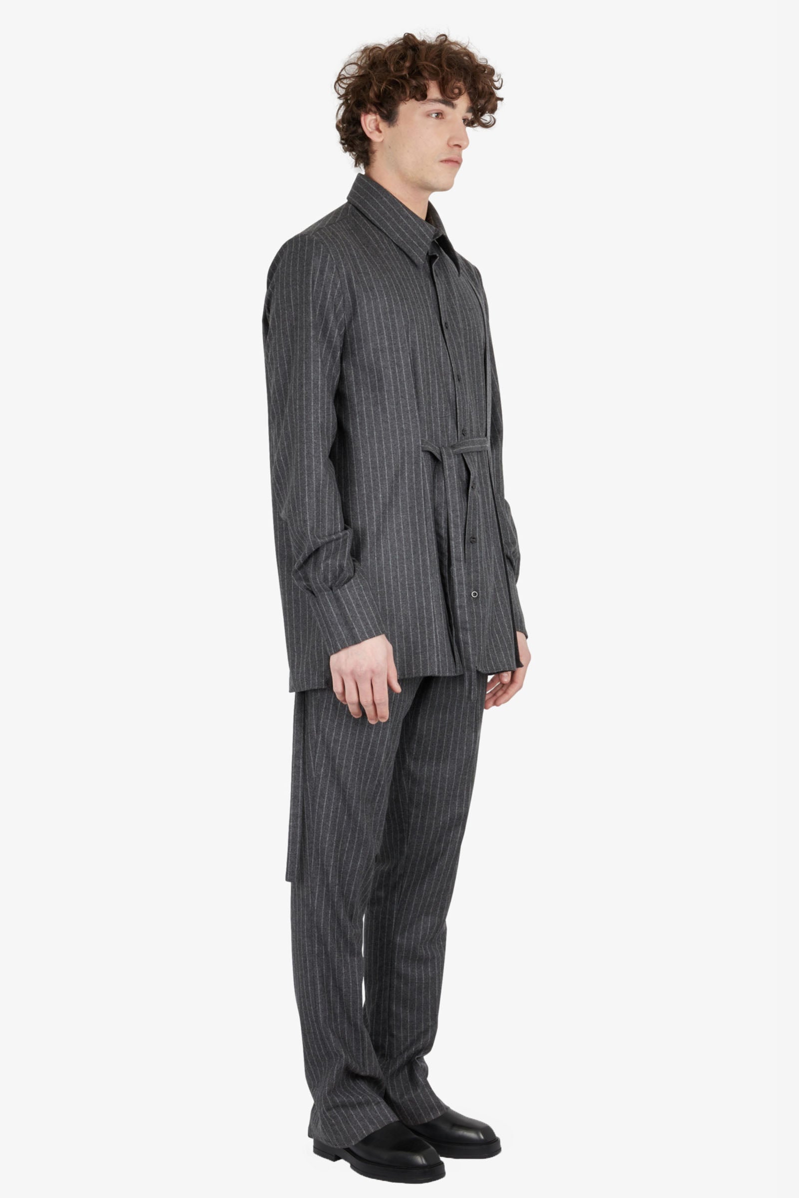 Tailored trousers with strapped falling pocket