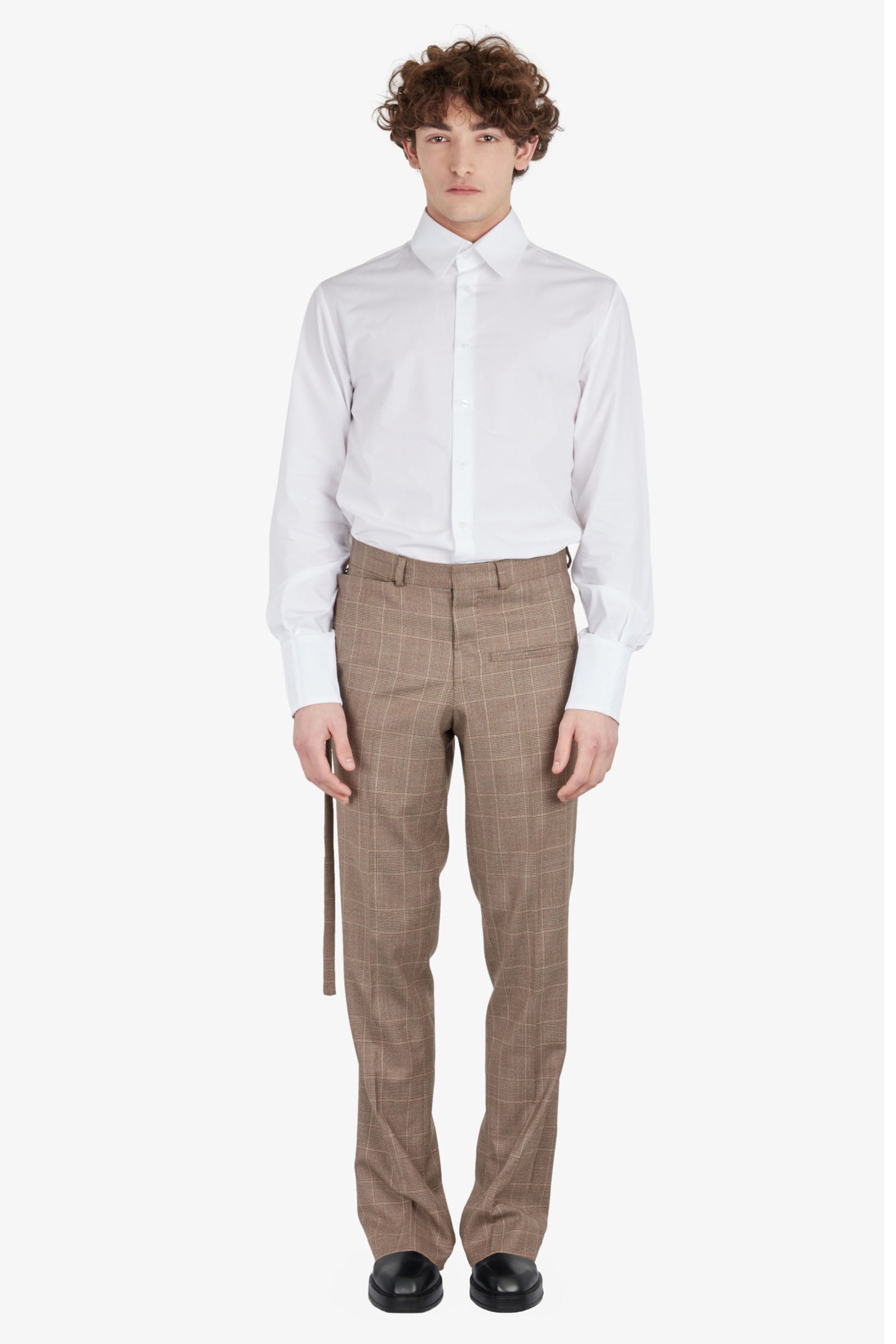 Tailored trousers with strapped falling pocket